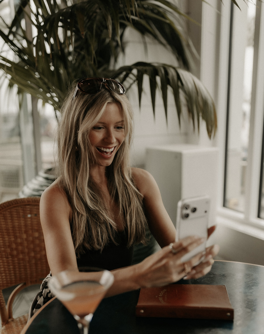 Brittany seated at a café table
